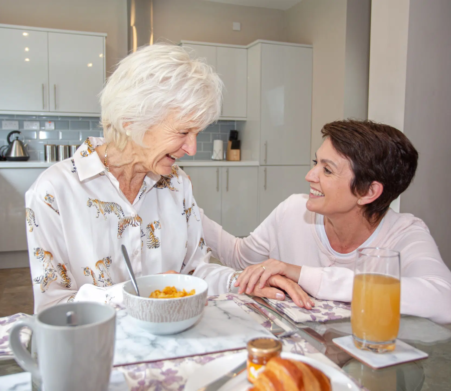 female-carer-crouching-beside-elderly-lady-tiger-printed-shirt-having-breakfast-smiling_4x3.jpg female-carer-crouching-beside-elderly-lady-tiger-printed-shirt-having-breakfast-smiling_4x3.jpg