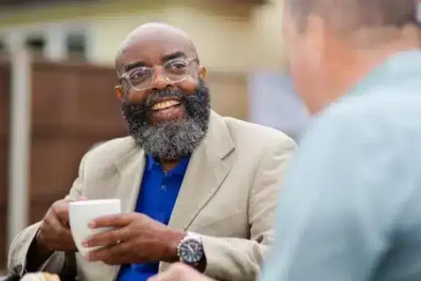 man-with-glasses-blazer-and-hot-drink-male-carer-in-foreground_2x1-768×384-1 man-with-glasses-blazer-and-hot-drink-male-carer-in-foreground_2x1-768x384-1